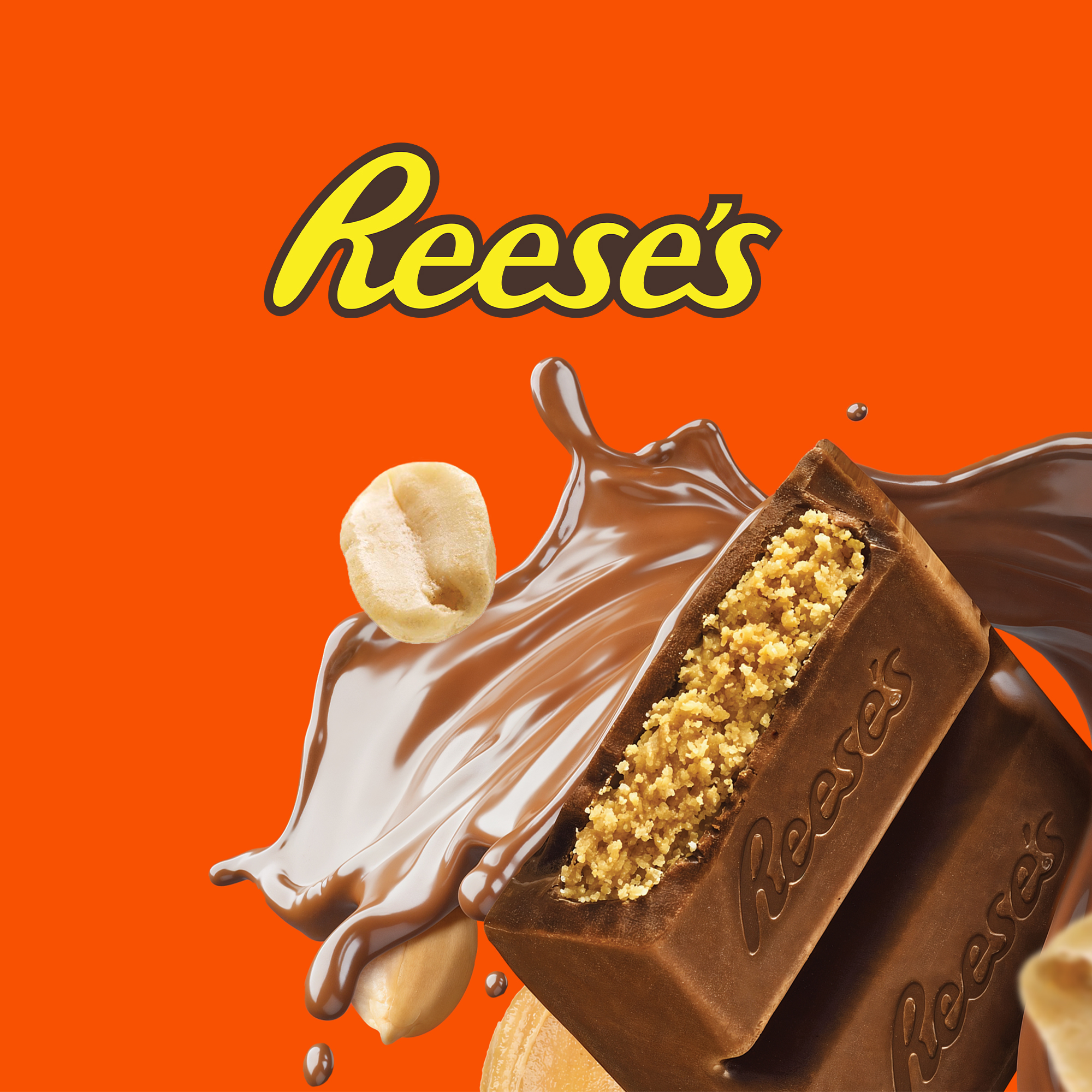 Reeses peanut butter chocolate bar broken in half with chocolate splash and peanuts