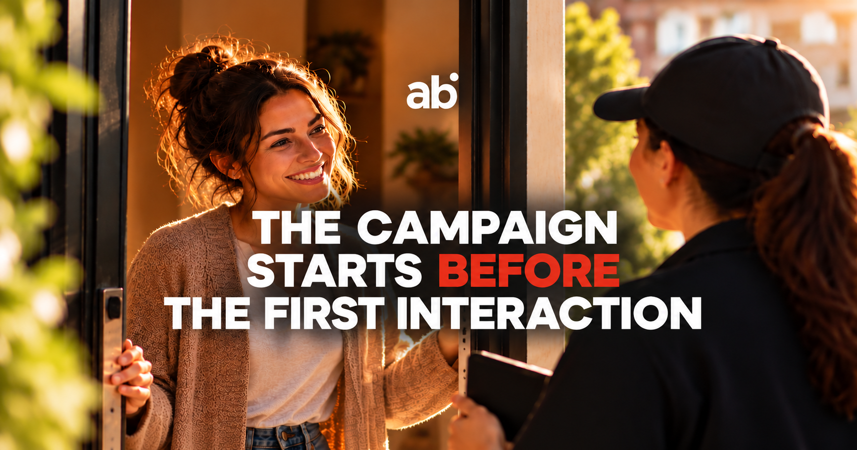 Woman opening a door to a visitor, illustrating the first interaction in consumer engagement