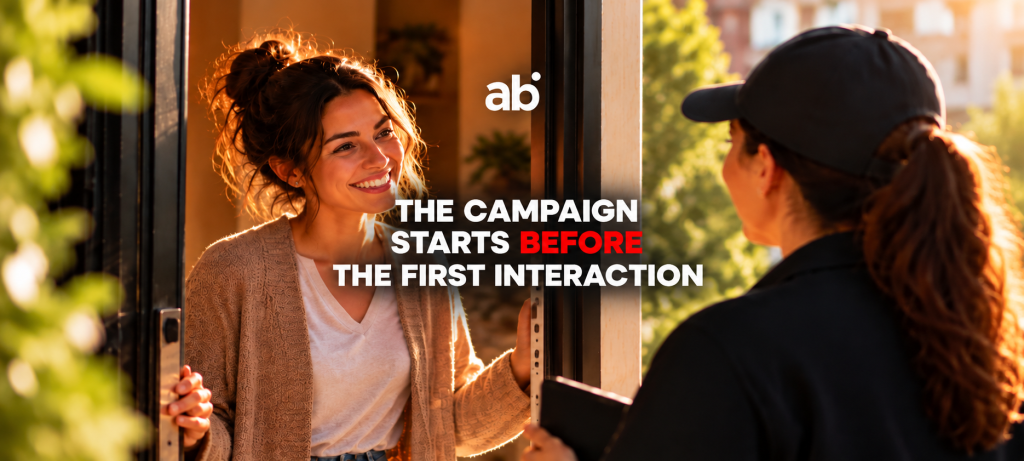 Woman opening a door to a visitor, illustrating the first interaction in consumer engagement